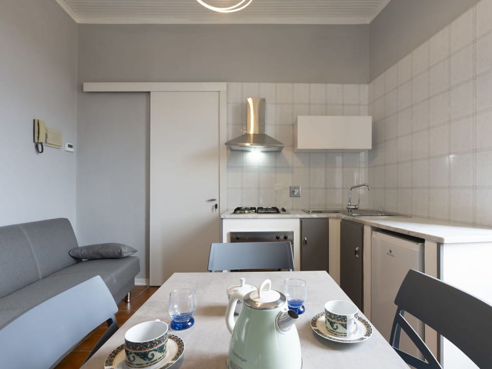 Sky, Plant, Cloud, Street Light, Urban Design, Road Surface, Tree, Building, Landscape, Road