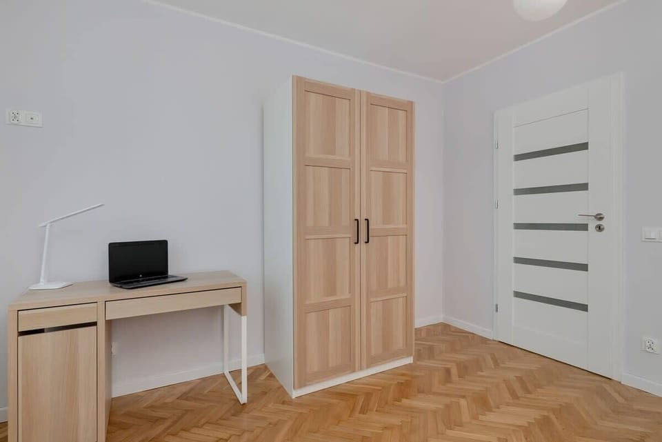 The bedroom's bright and functional space is ideal for unwinding. 