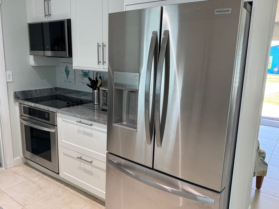 Kitchen stove and brand new refrigerator
