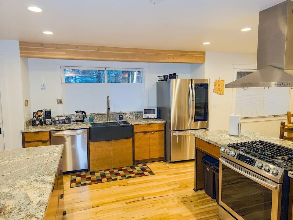 The kitchen offers spacious granite counter tops and everything to stay in instead of dining out.