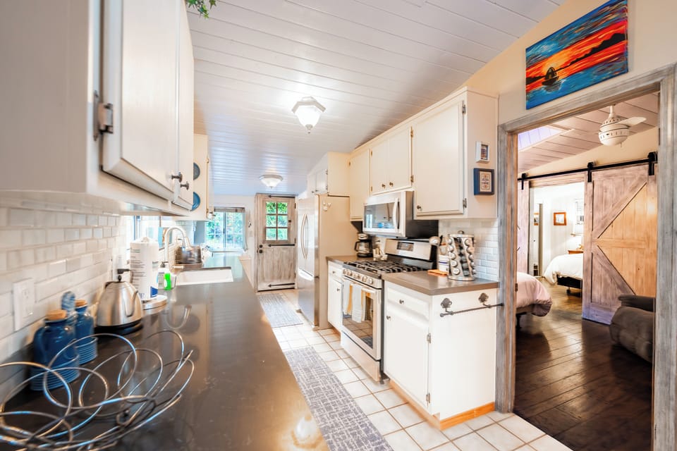Sliding door connects one of the bedrooms to the kitchen