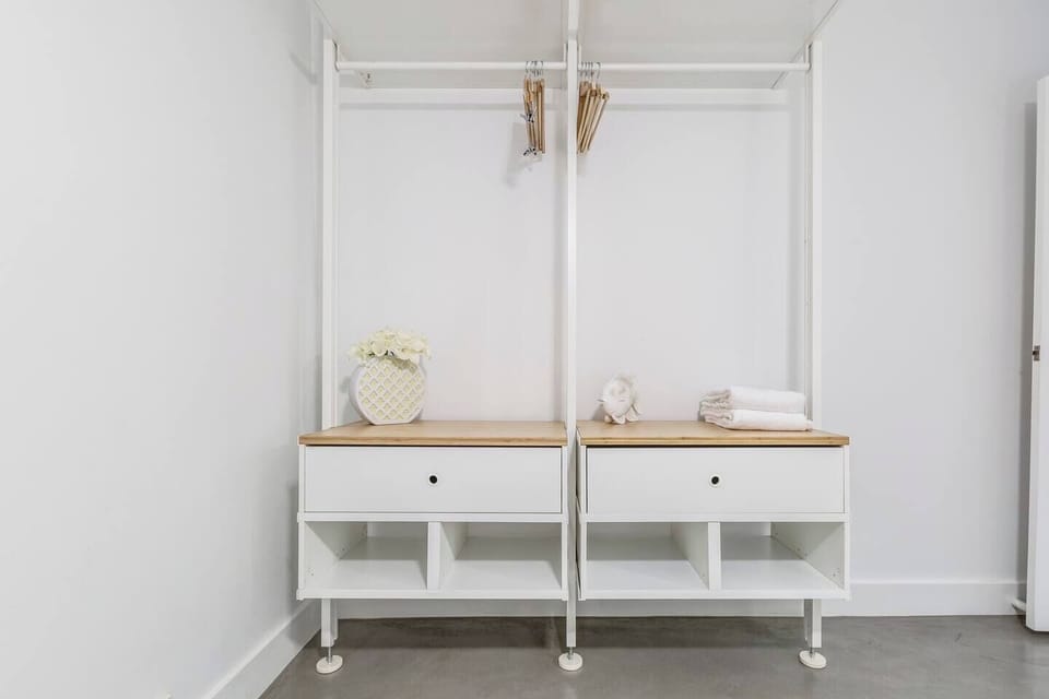 Open wardrobes in both bedrooms provide ample storage for your belongings. 