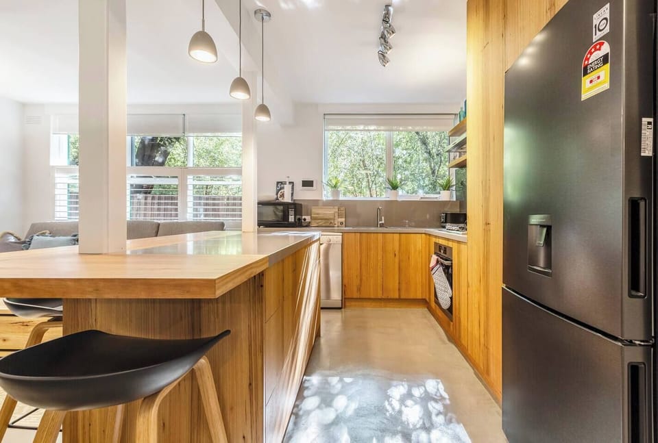 The kitchen is a sleek space to prepare meals at home, with high-quality appliances and cooking utensils.
