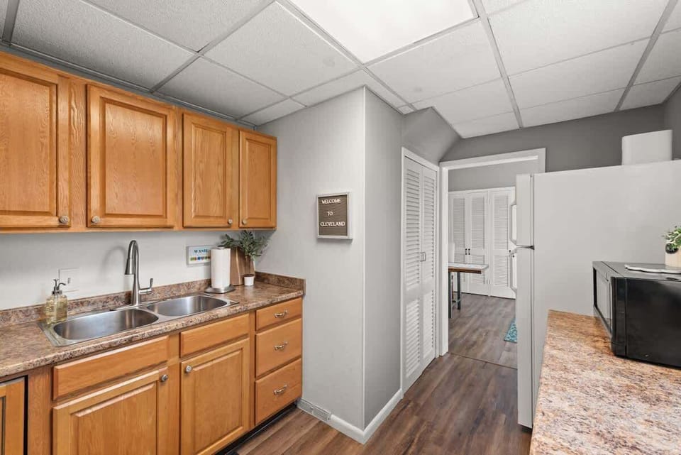 - Bright kitchen with dual sink and plenty of counter space   - Ample cabinets for storage and modern appliances included   - Easy layout perfect for cooking together with friends  