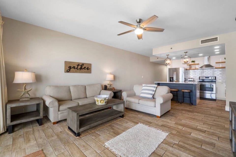 Living Area with Ocean Views, Sleeper Sofa, Large Flat Screen TV, and Private Balcony Access