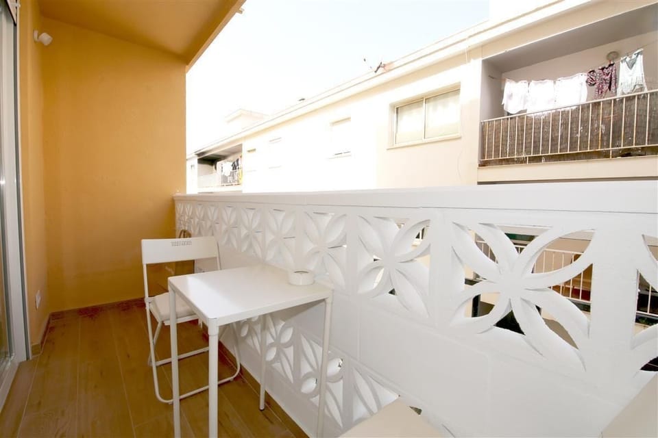 More pictures of the balcony with outdoor dining table for two guests