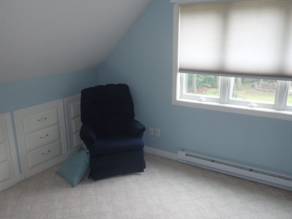 Recliner in twin bedroom