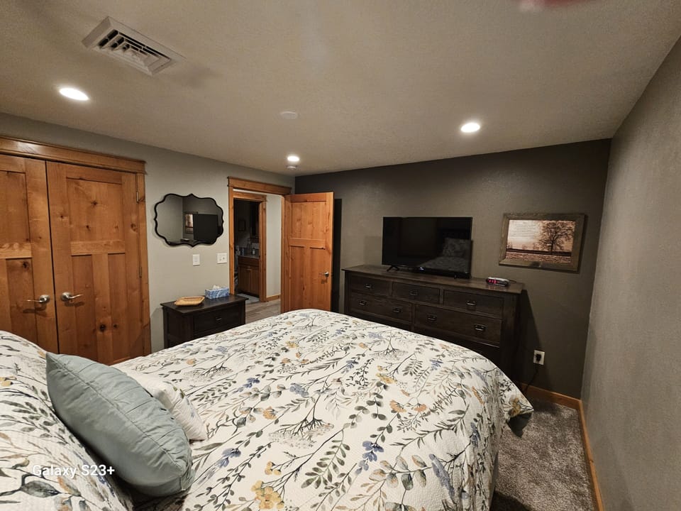 Bedroom 1 - includes queen size bed and 32-inch tv with streaming options.
