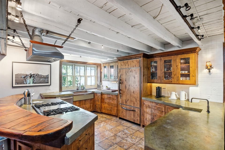Chef's kitchen includes SubZero fridge, Wolf stove and coffee station. 