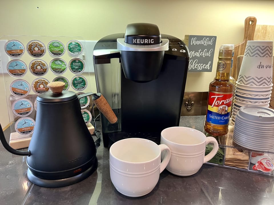 There is a fully stocked coffee station.