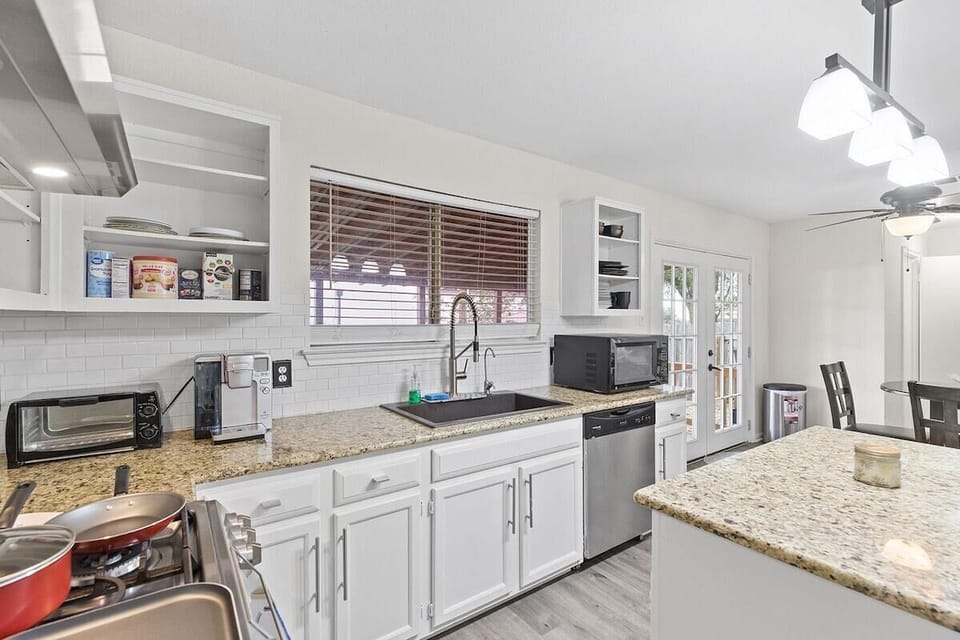 Large granite counter tops and open range for cooking a delicious meal at home!