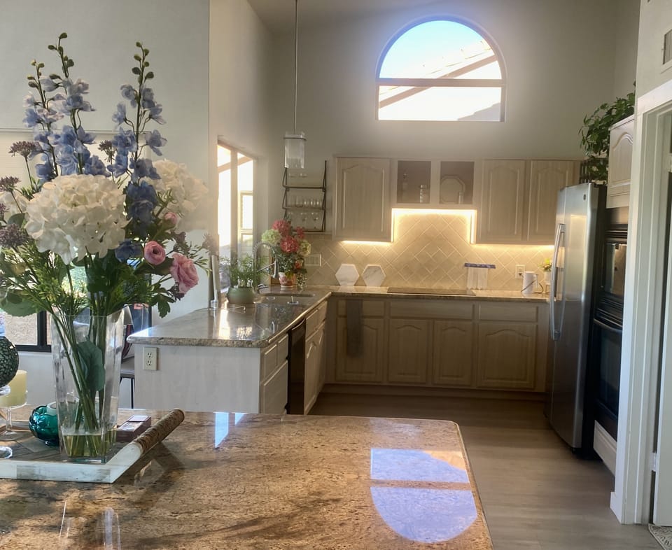 Kitchen with Induction cooktop, microwave, air fryer, oven, drawers.