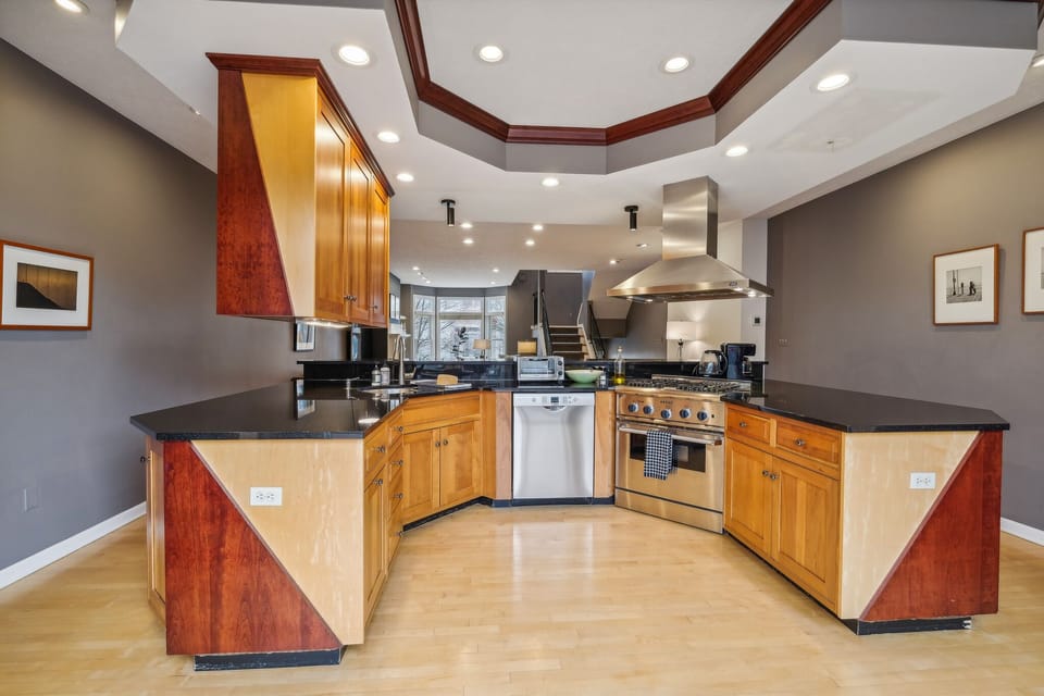 Modern kitchen with Thermador stove/oven, Bosch fridge and dishwasher.