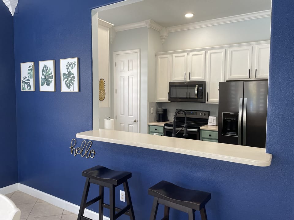 Fully stocked kitchen open to living and dining space.