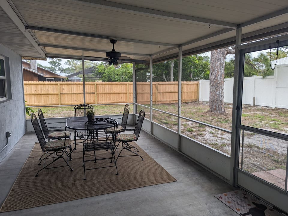 Large screened in back patio and fully fenced back yard