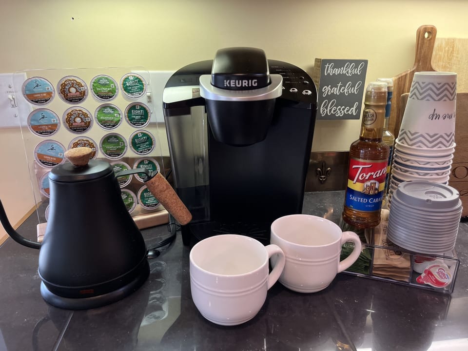 There is a fully stocked coffee station.