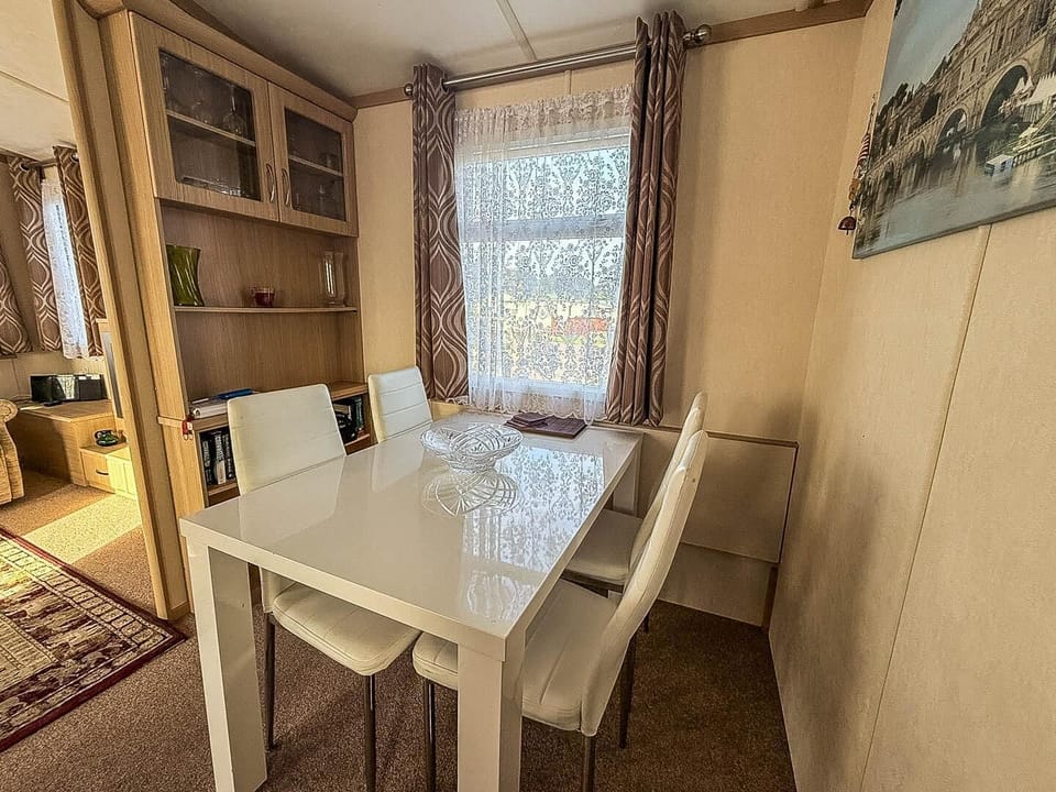 Cozy dining nook with natural light and built-in shelves