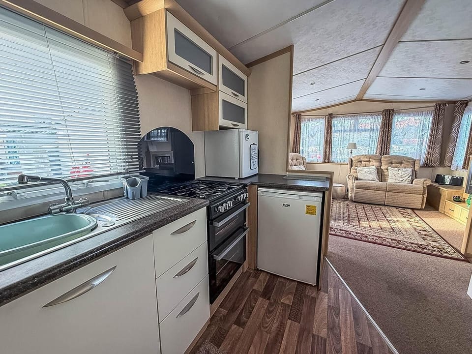 Bright, airy kitchen with scenic views and cozy living area