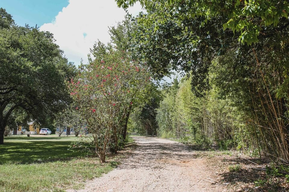 The cottages are tucked off the street. Follow the gravel driveway to get to the cozy cottages in the back.