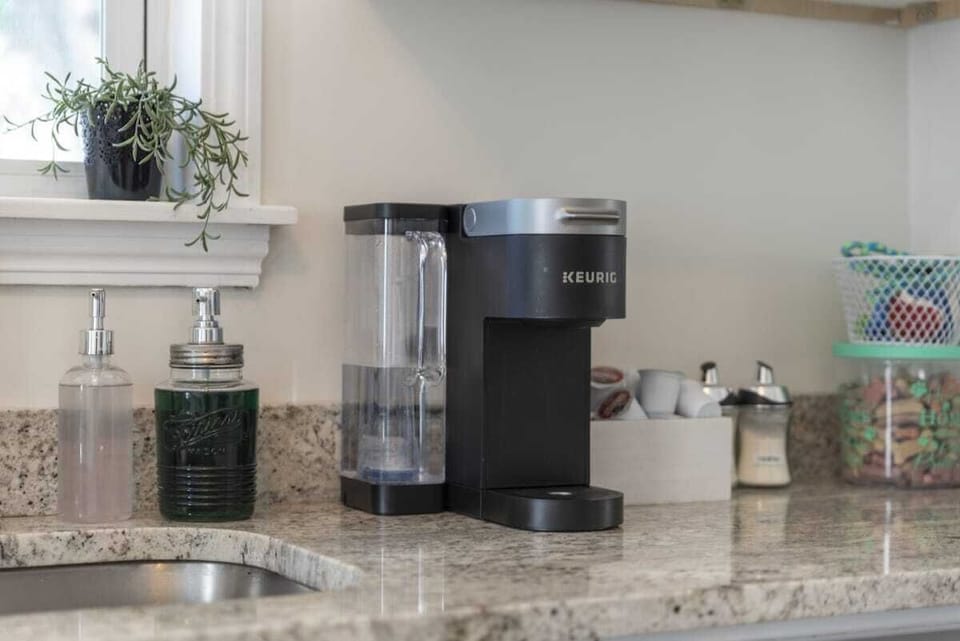 Elevate your culinary space with the timeless elegance of white cabinets and the contemporary flair of stainless steel appliances. Your dream kitchen awaits!