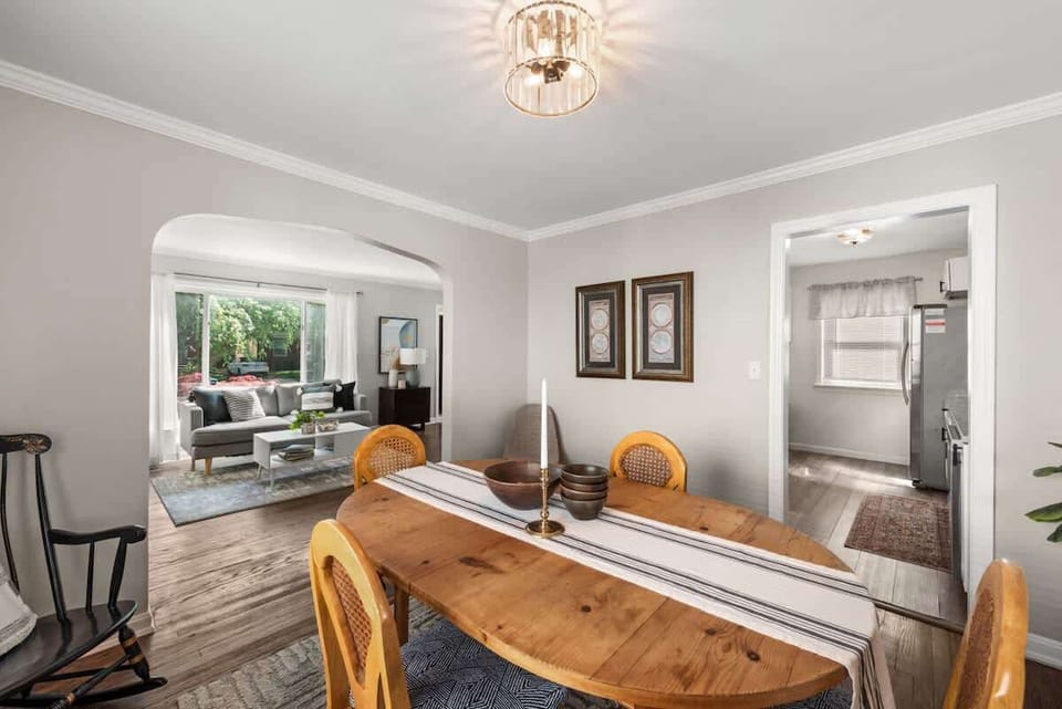 Welcome to the heart of the home - a beautifully curated living room with gleaming hardwood floors and a stylish dining table that beckons you to linger over good food and great conversations. #HomeSweetHome 