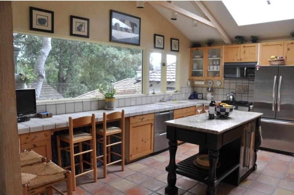 Kitchen, with modern appliances, bar area, island, and tons of natural light!