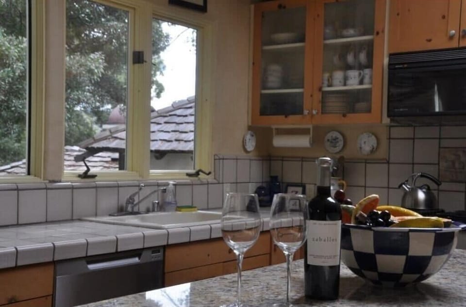 Kitchen, with modern appliances, bar area, island, and tons of natural light!