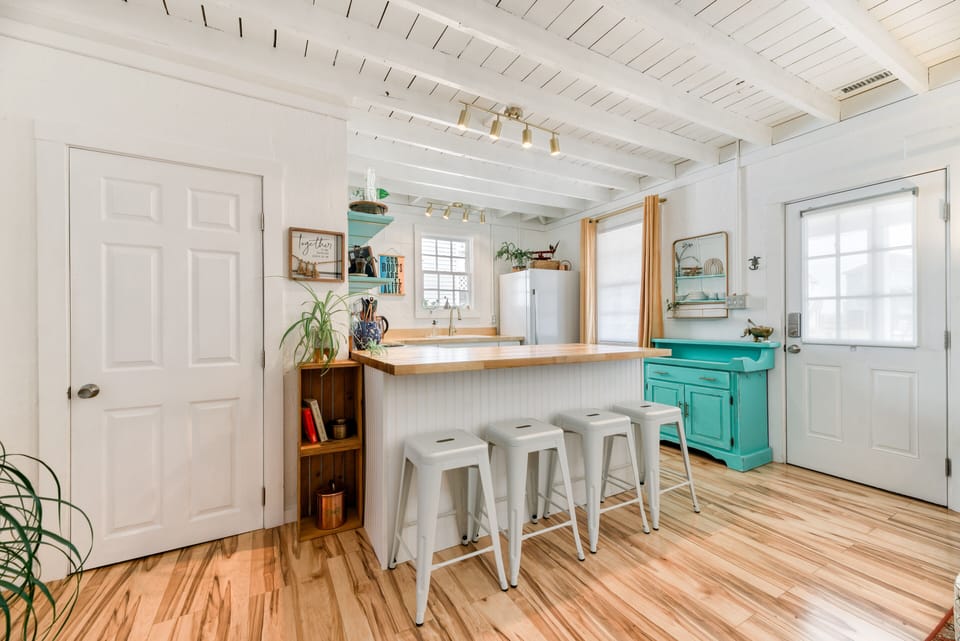 Kitchen - The glazed butcher block breakfast bar is a great place to catch a bite.