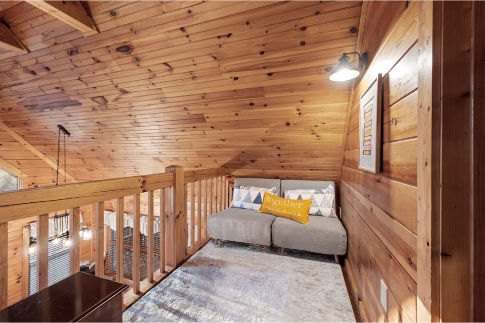Our loft is a flex space! Pull out the chairs to make 2 twin beds. 