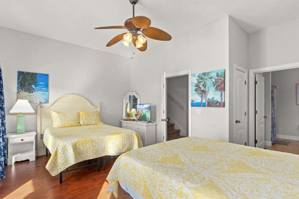 2nd floor 2 queen room with smart TV, attached en-suite, and private balcony. This room sleeps 4.