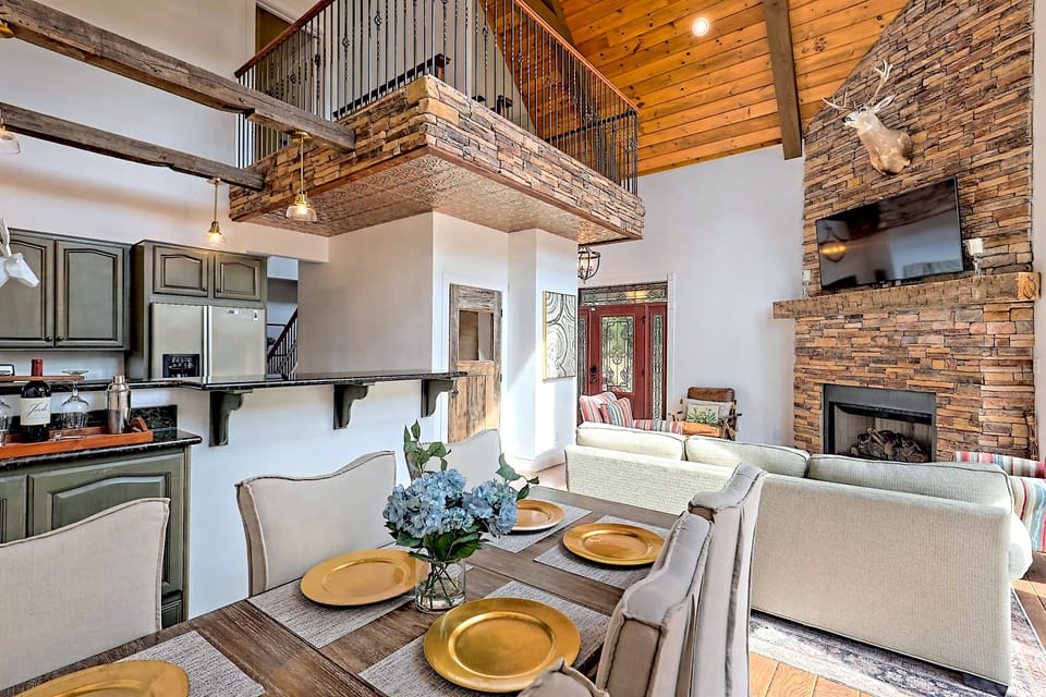 Tall ceilings in living room with overlooking indoor balcony.  