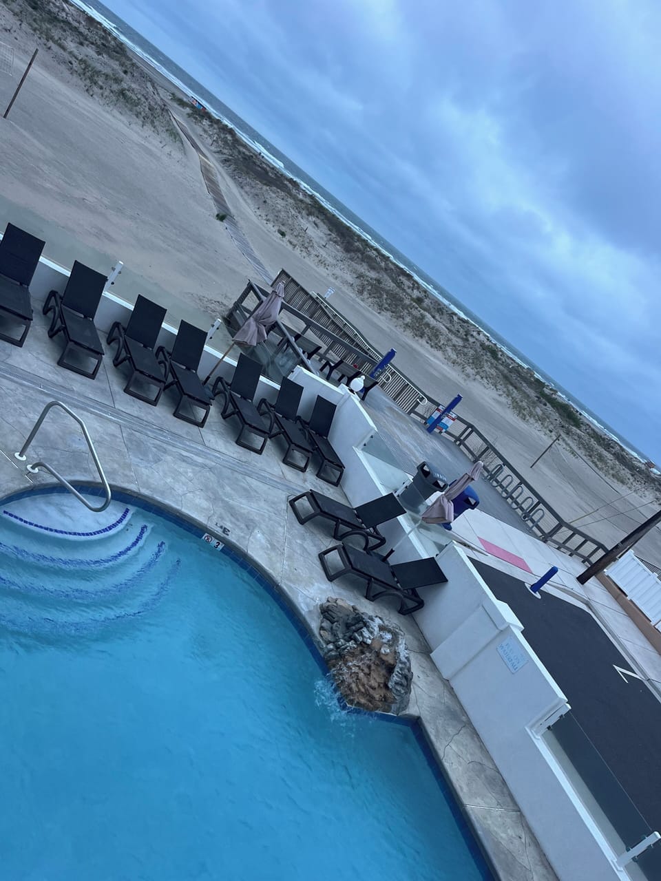 View of pool from outside exterior front door.
