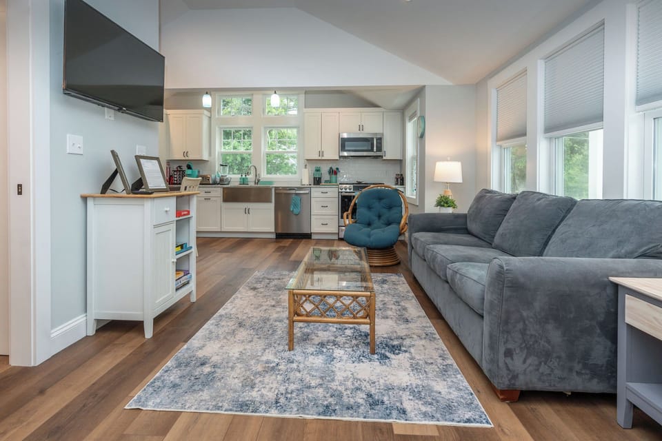 The living room leading to the kitchen/dining area