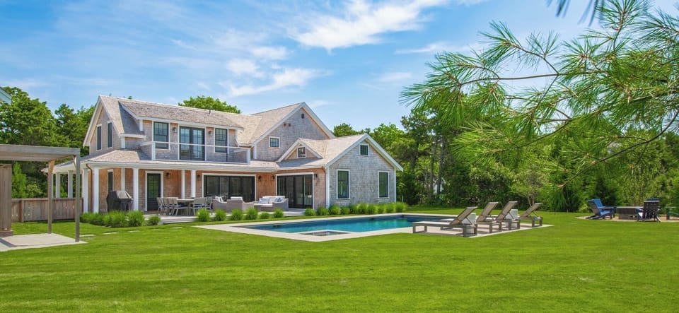 Backyard with heated salt water pool/spa, firepit, outdoor shower and deck.