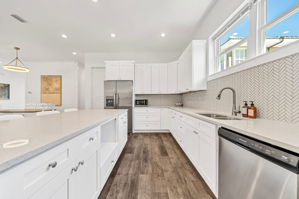 Large Open Kitchen with Dine in Kitchen Island, Large Prep Space and Stunning Kitchenaide Appliances.
