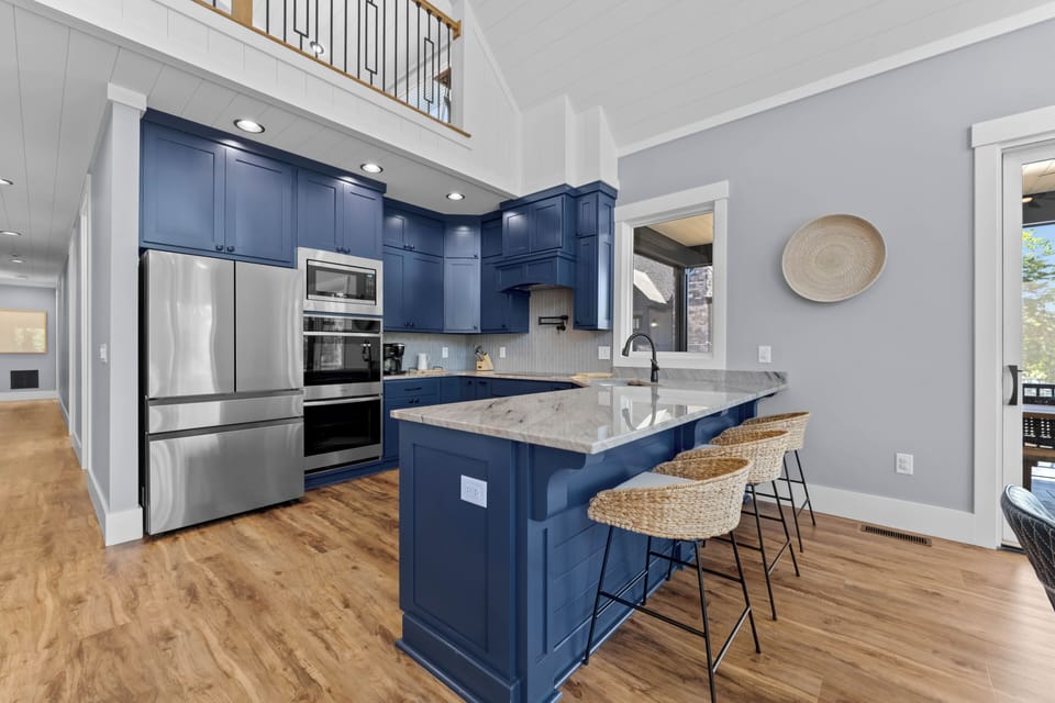 Blue Heron's Fully equipped kitchen with additional barstool seating.