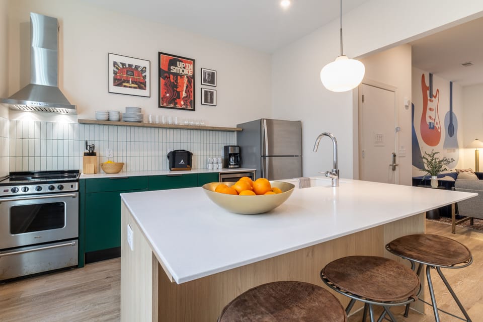 Kitchen features modern stainless steel appliances.