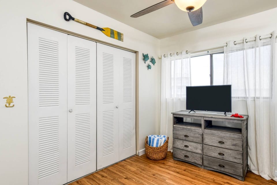 The large room features an additional smart tv and full closet!