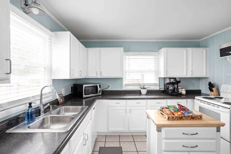 Whip up delicious meals in this airy space, complete with modern appliances and charm!