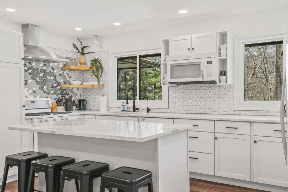 Updated kitchen with bar seating, large island & coffee/tea station