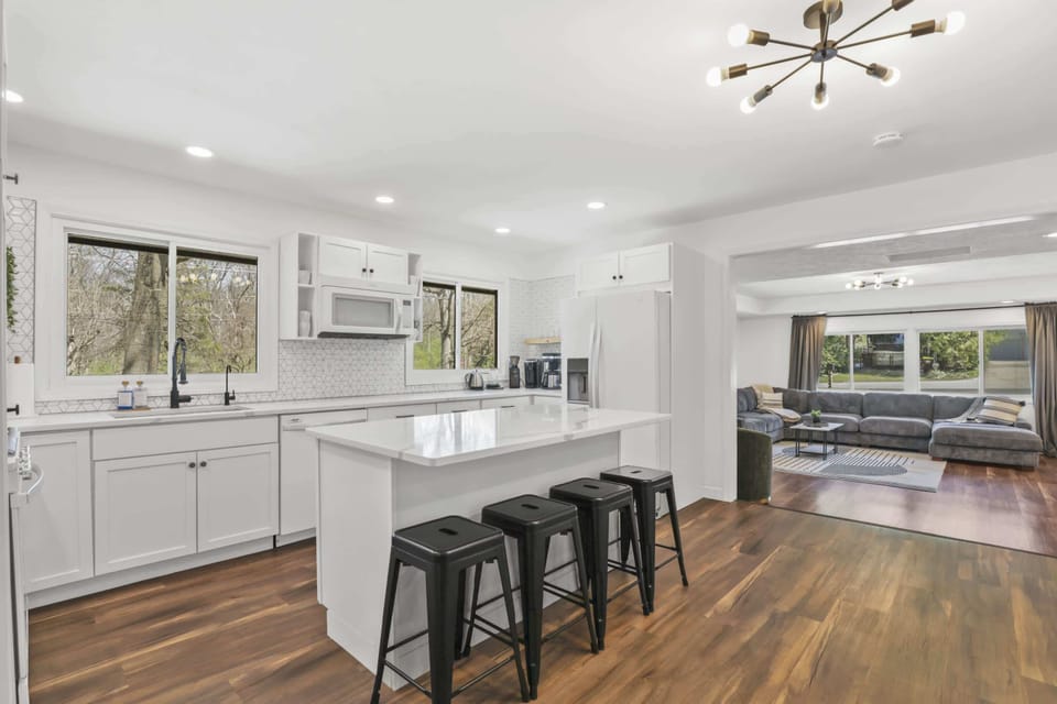 Updated kitchen with bar seating, large island & coffee/tea station