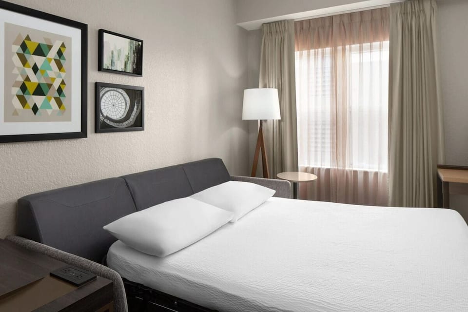 Unwind in crisp linens with soft daylight and calm décor.