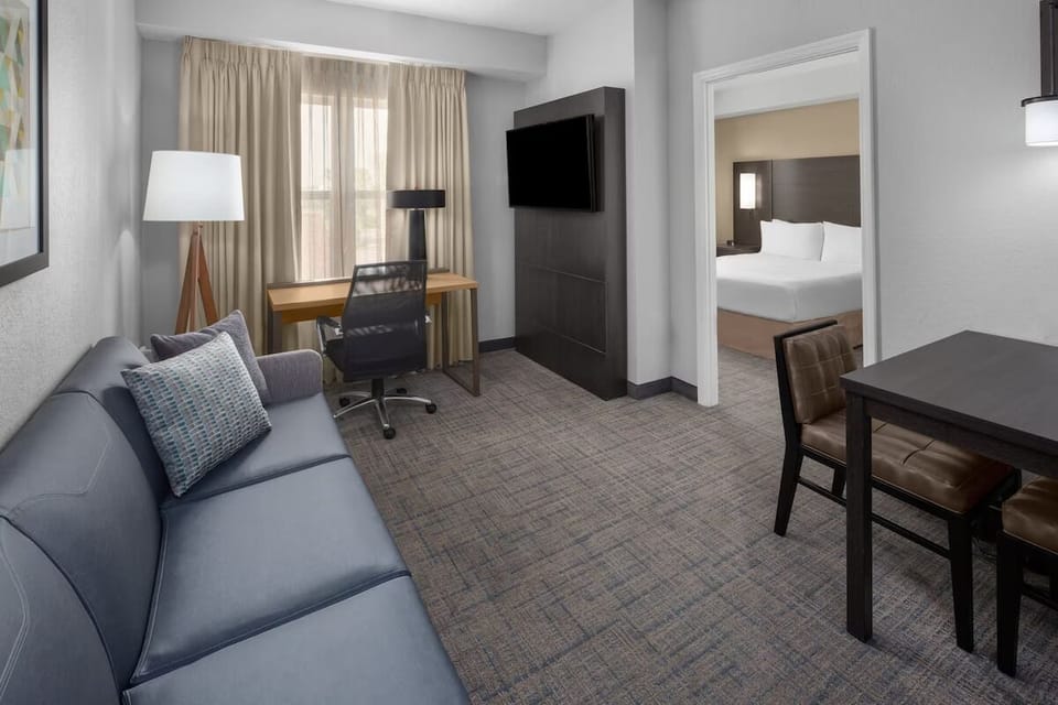 Settle in with a dedicated desk, lounge seating, and TV.