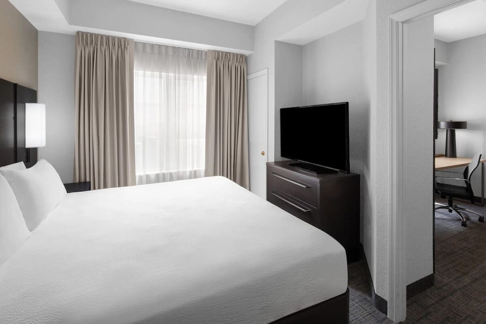 Recharge in a quiet bedroom with soft light and privacy.