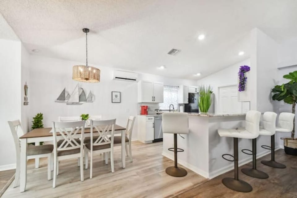 Fully stocked kitchen with island seating and dining for six