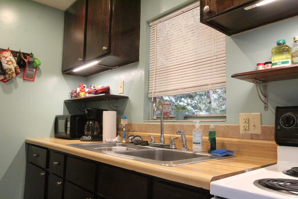 Full kitchen with stove and full size refrigerator coffee and tea. 