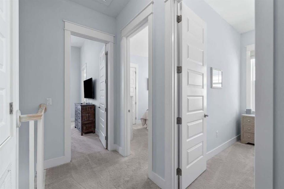 A bright and airy upstairs corridor with easy access to bedrooms.