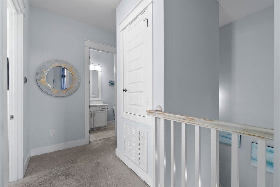 A well-decorated hallway with soft coastal-inspired details.