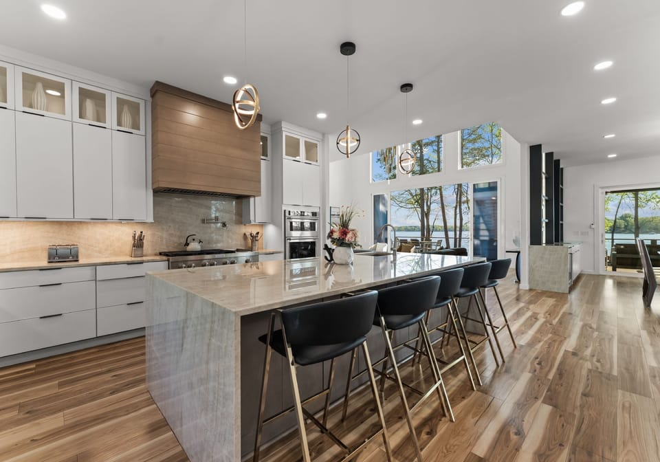 Fully stocked kitchen with island seating for 5, waterfall countertop and large fridge! 