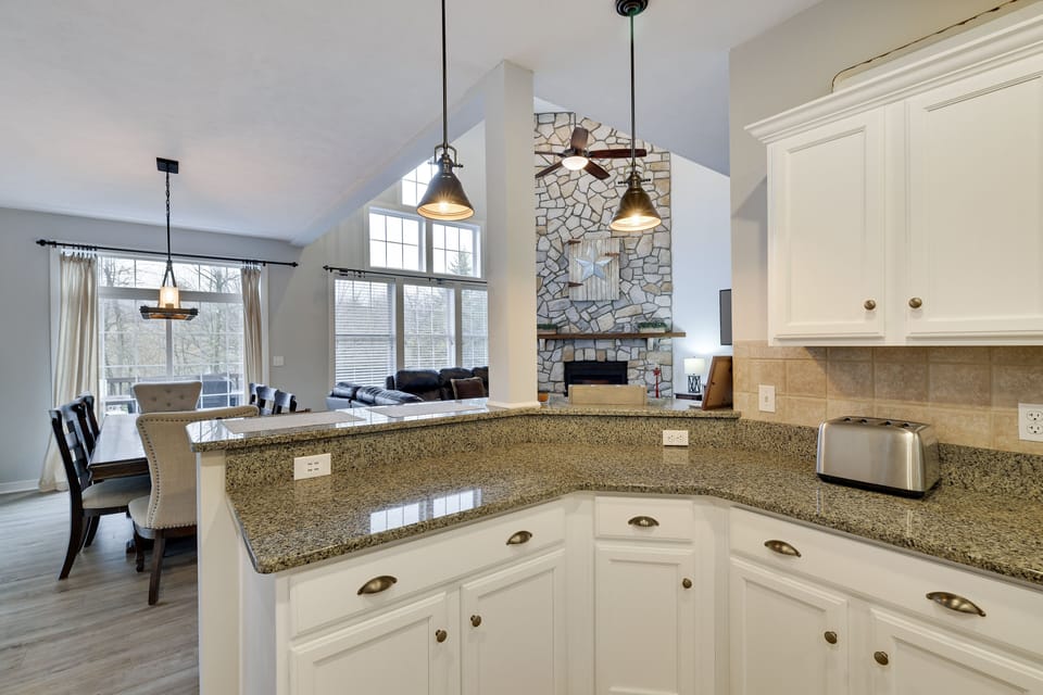Granite countertops and white cabinets: a timeless combination.